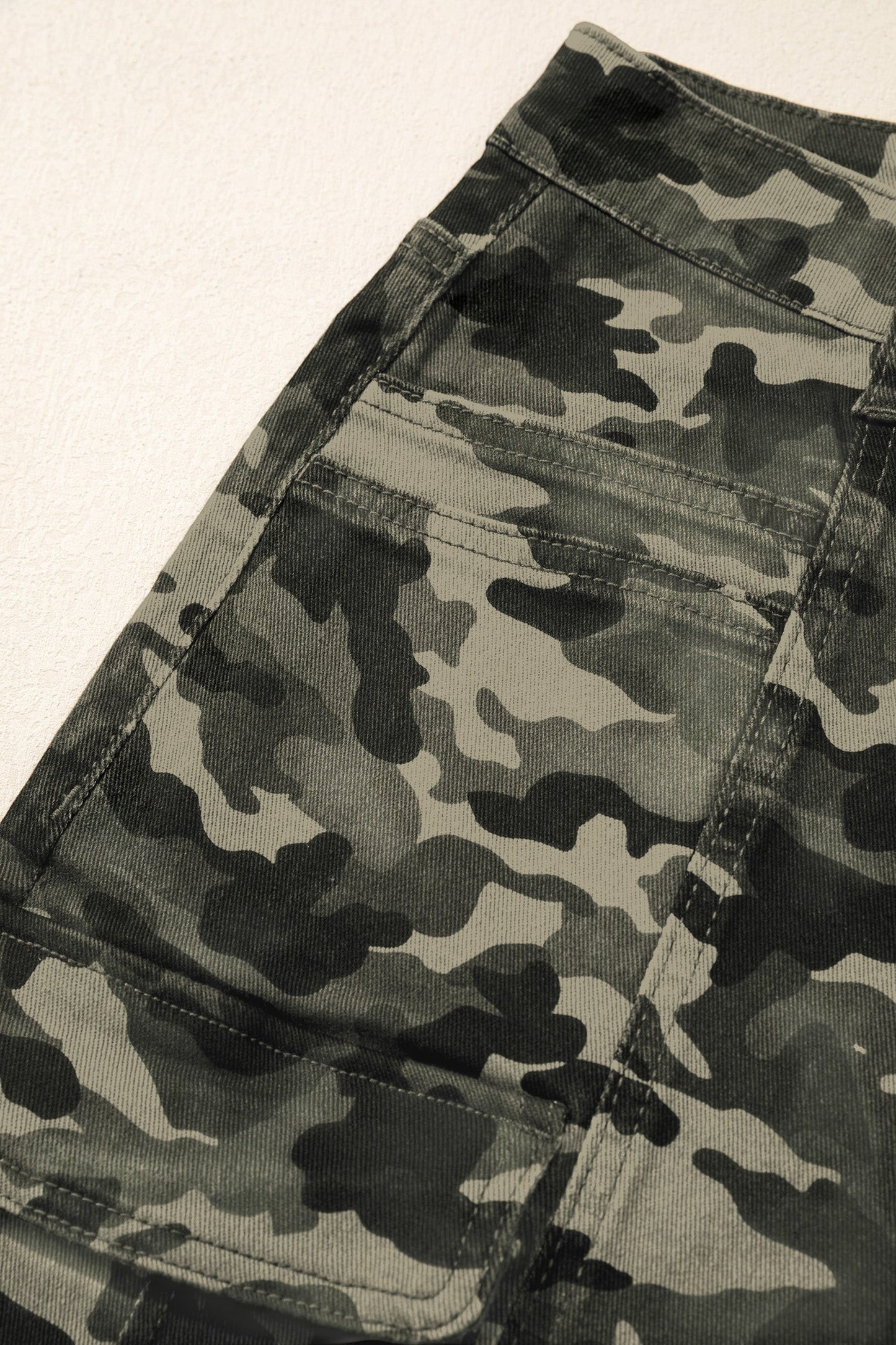 Doodlations Coffee Bar & Boutique women's camouflage utility cargo pants with spacious side pockets and durable fabric.