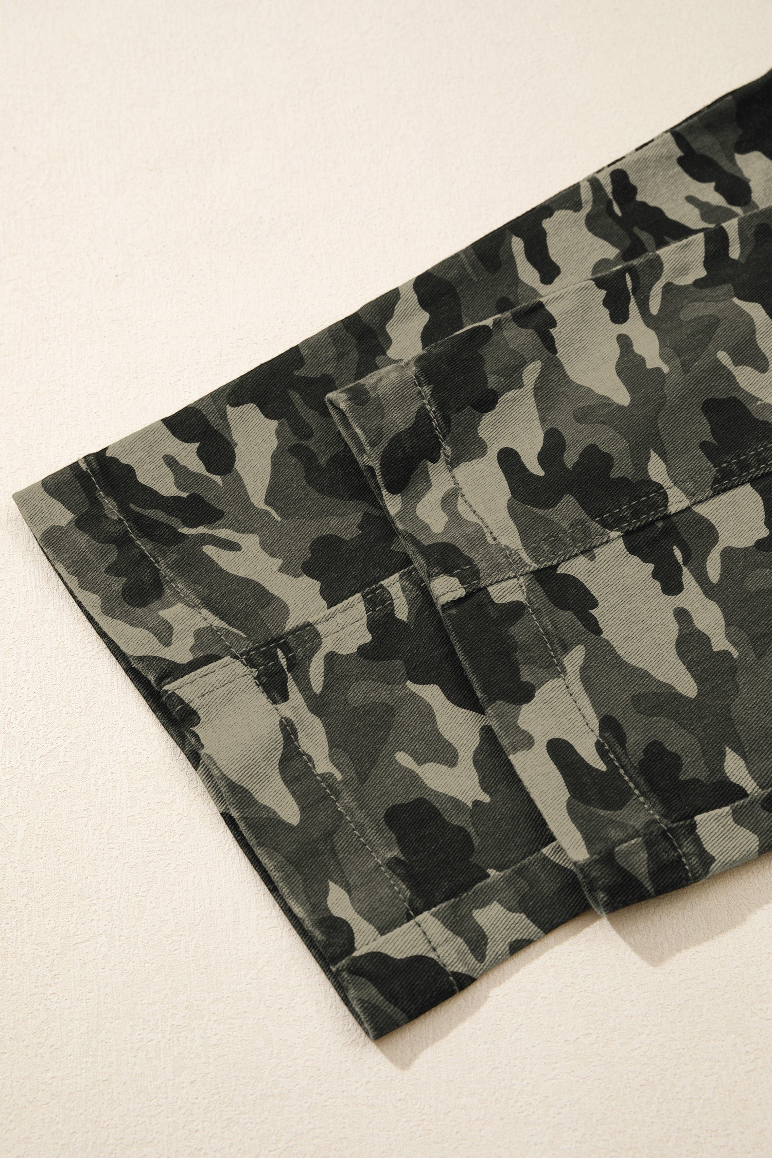 Doodlations Coffee Bar & Boutique camouflage cargo pants featuring durable fabric and reinforced stitching detail.