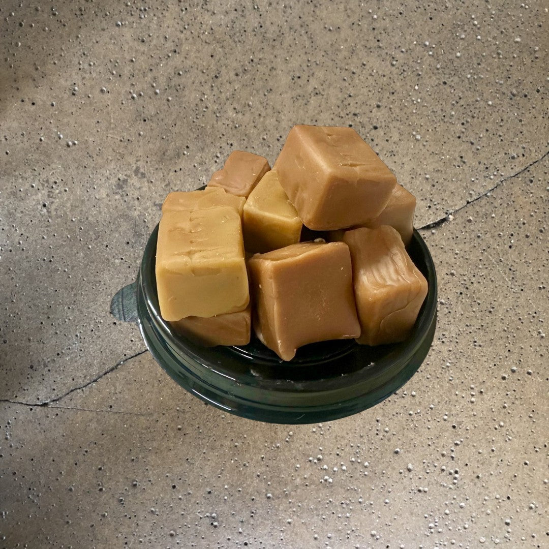 Doodlations Coffee Bar & Boutique Caramel Chew wax melts in a black container, creamy caramel scent.