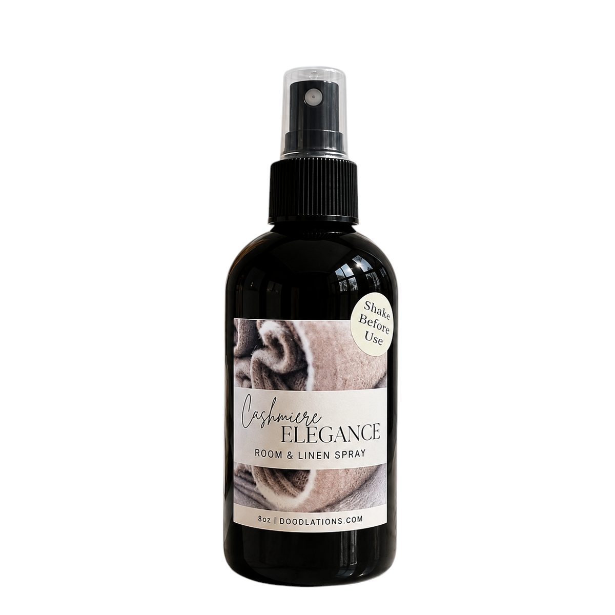 Doodlations Coffee Bar & Boutique Cashmere Elegance room and linen spray in a black bottle with a spray nozzle.