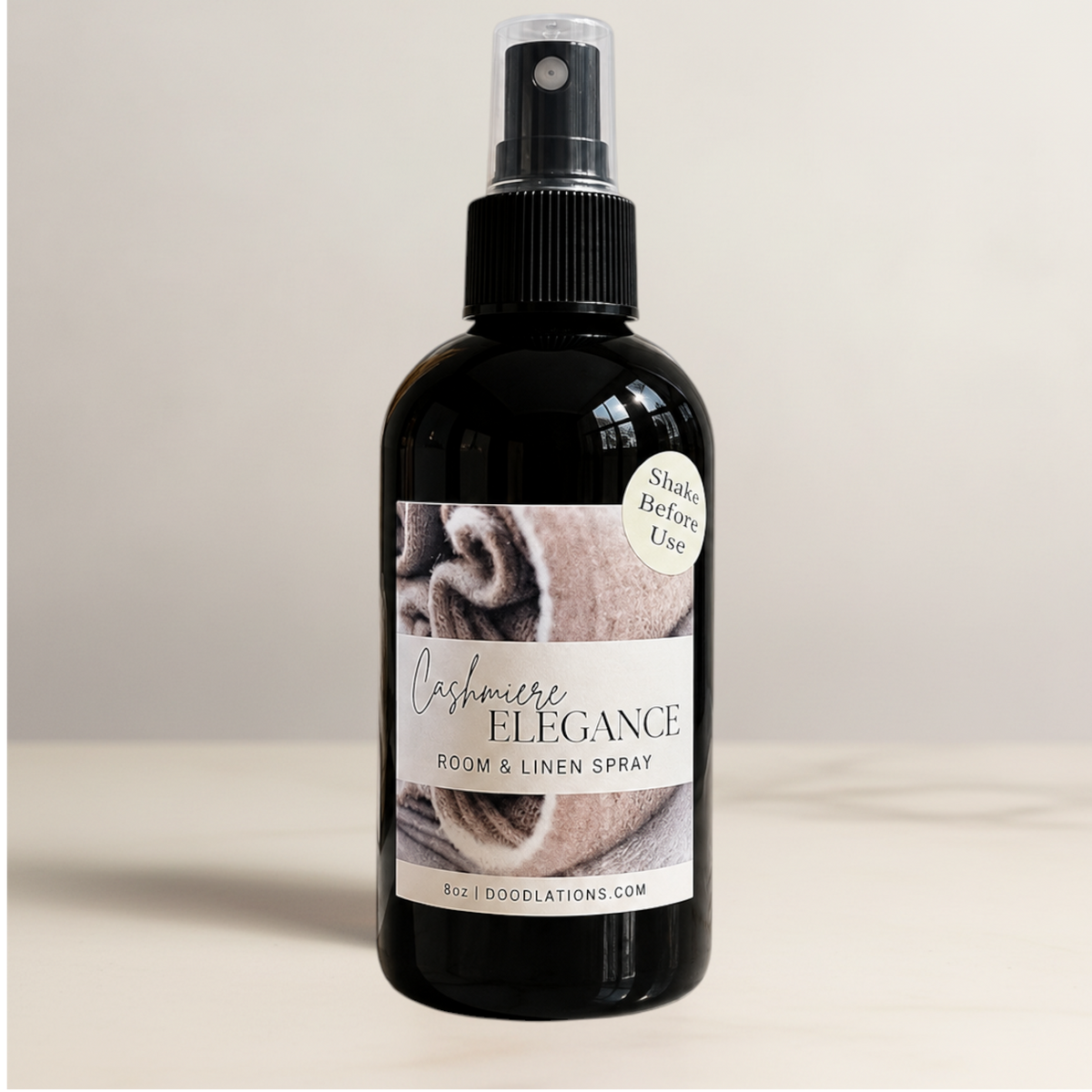 Doodlations Coffee Bar & Boutique Cashmere Elegance room and linen spray in an 8oz amber glass bottle with spray cap.