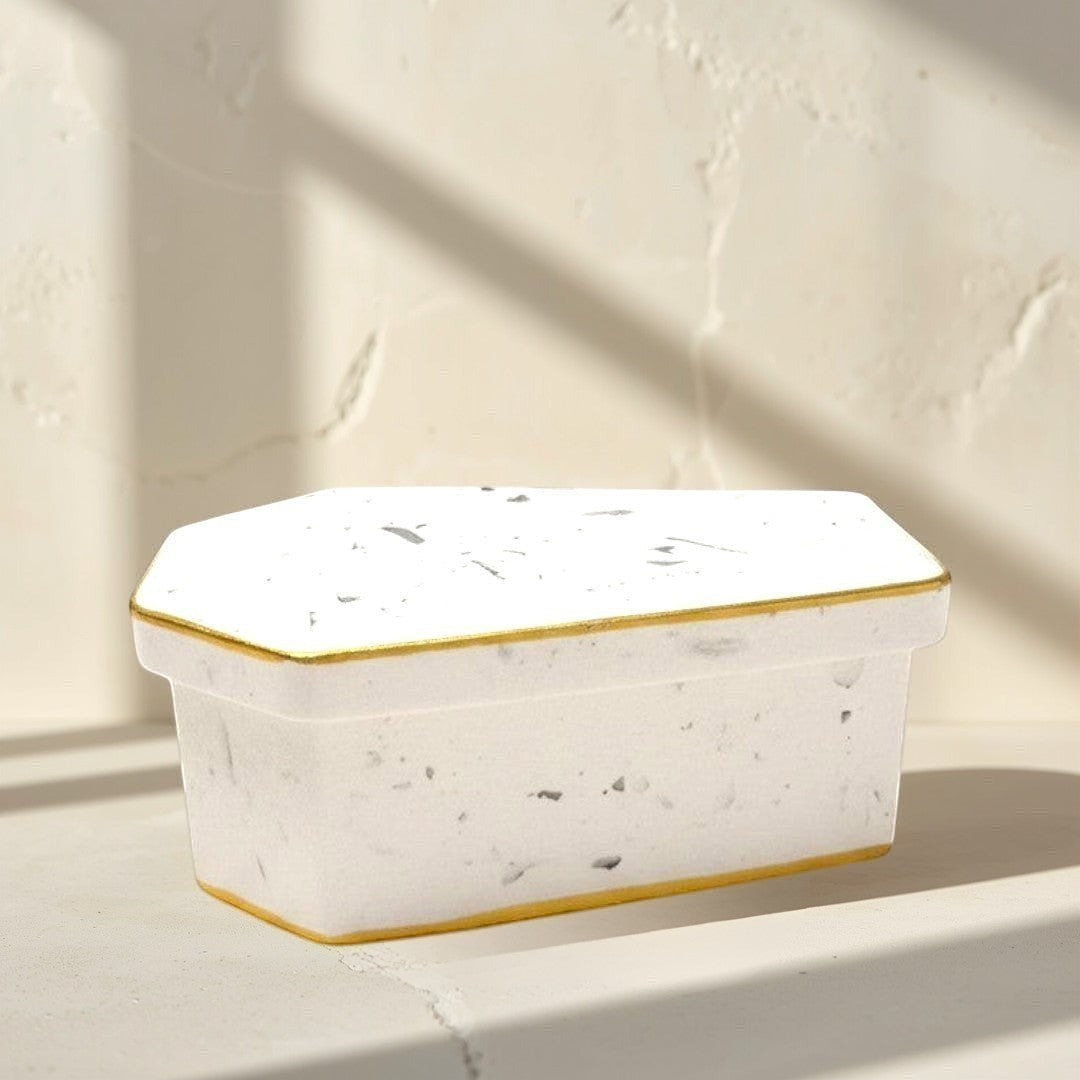 Doodlations Coffee Bar & Boutique casket concrete candle with two wicks and gold trim. Modern accent piece.