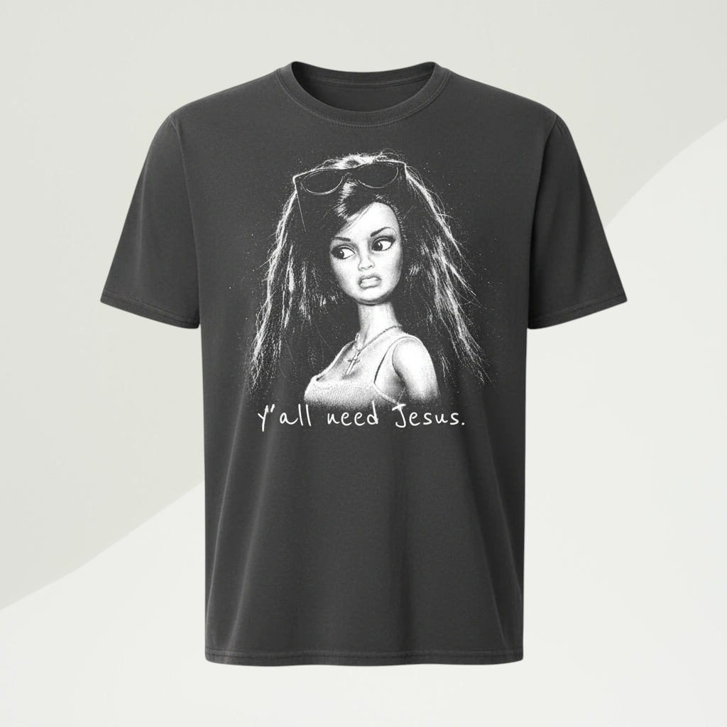 Doodlations Coffee Bar & Boutique charcoal grey cotton t-shirt with a humorous doll graphic and Y'all Need Jesus text