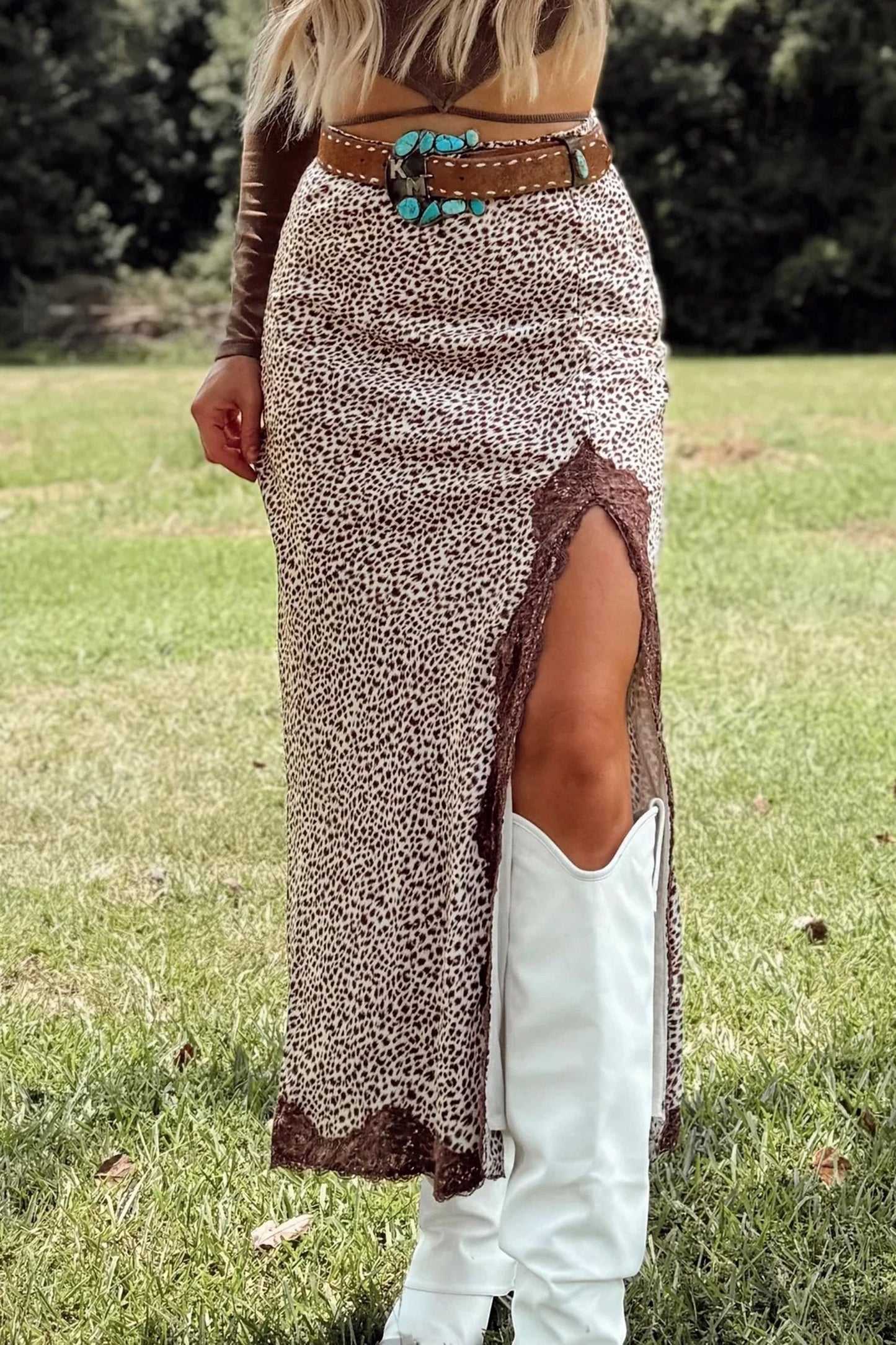 Doodlations Coffee Bar & Boutique brown cheetah print long skirt with lace trim and side split worn with white boots