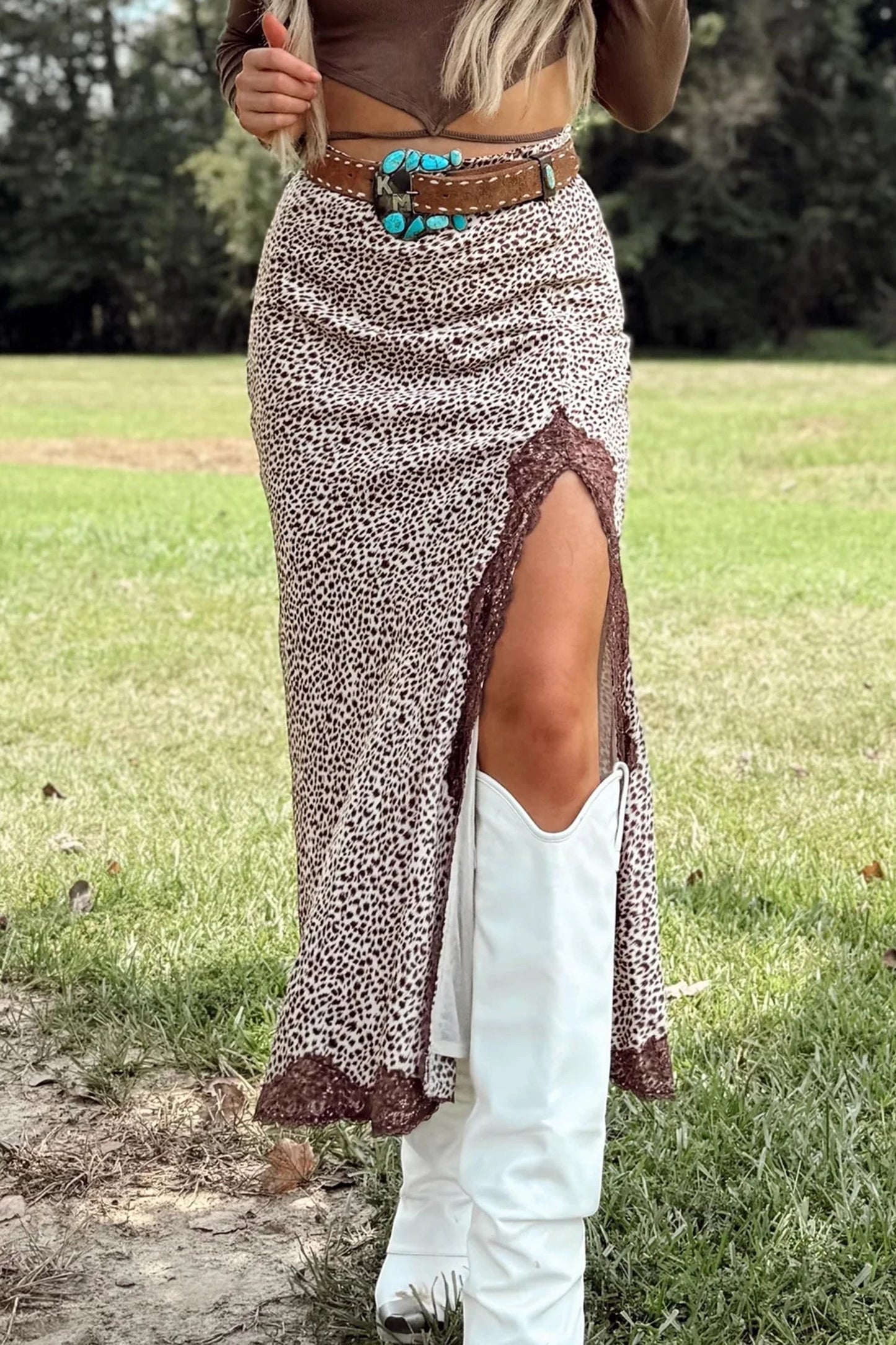 Doodlations Coffee Bar & Boutique brown cheetah print long skirt with lace trim and side split, worn with white boots.