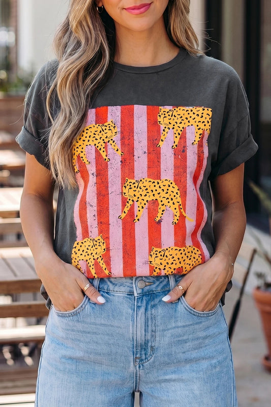Doodlations Coffee Bar & Boutique dark grey graphic tee with yellow cheetahs and pink stripes on a woman
