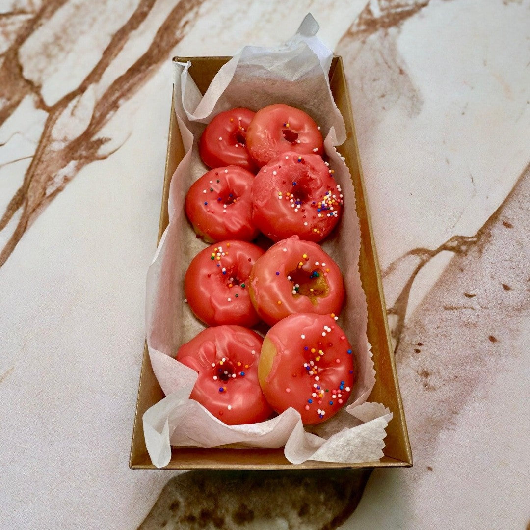 Doodlations Coffee Bar & Boutique Cherry Glazed Doughnut Wax Melts with pink glaze and colorful sprinkles.