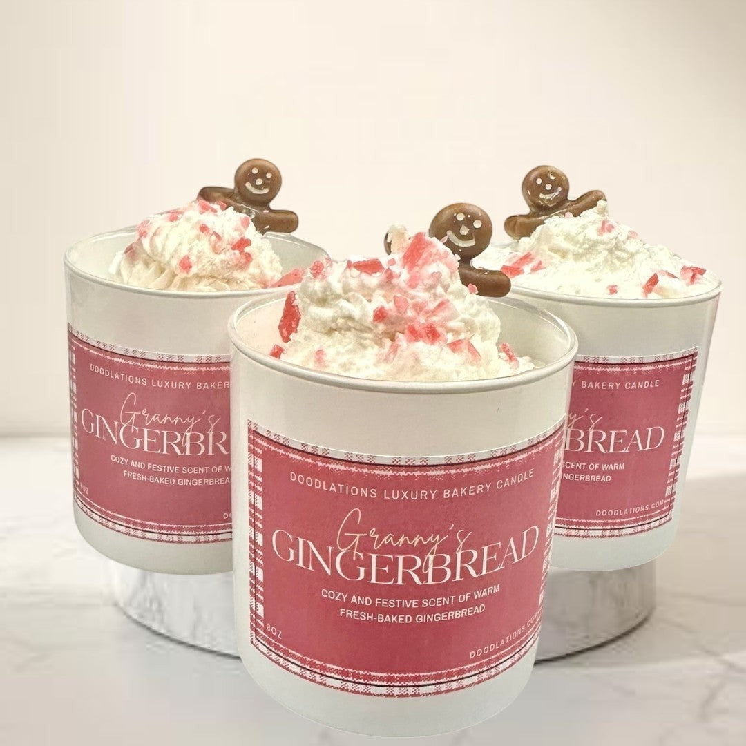 Doodlations Coffee Bar & Boutique Christmas Gingerbread luxury candle with whipped cream topping and gingerbread man decoration.