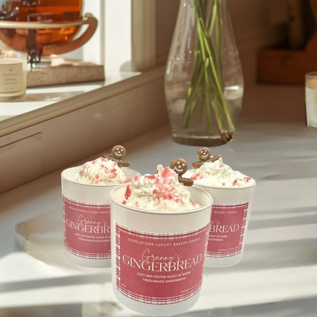 Doodlations Coffee Bar & Boutique Christmas Gingerbread luxury bakery candle with whipped cream and gingerbread man topper.