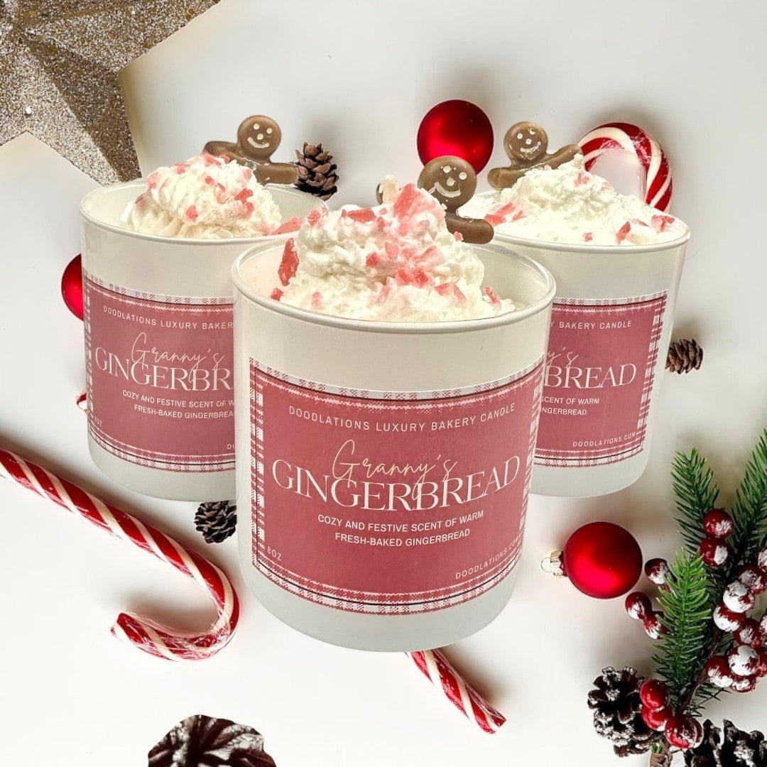 Doodlations Coffee Bar & Boutique Christmas Gingerbread luxury candle with whipped topping and gingerbread man accent.