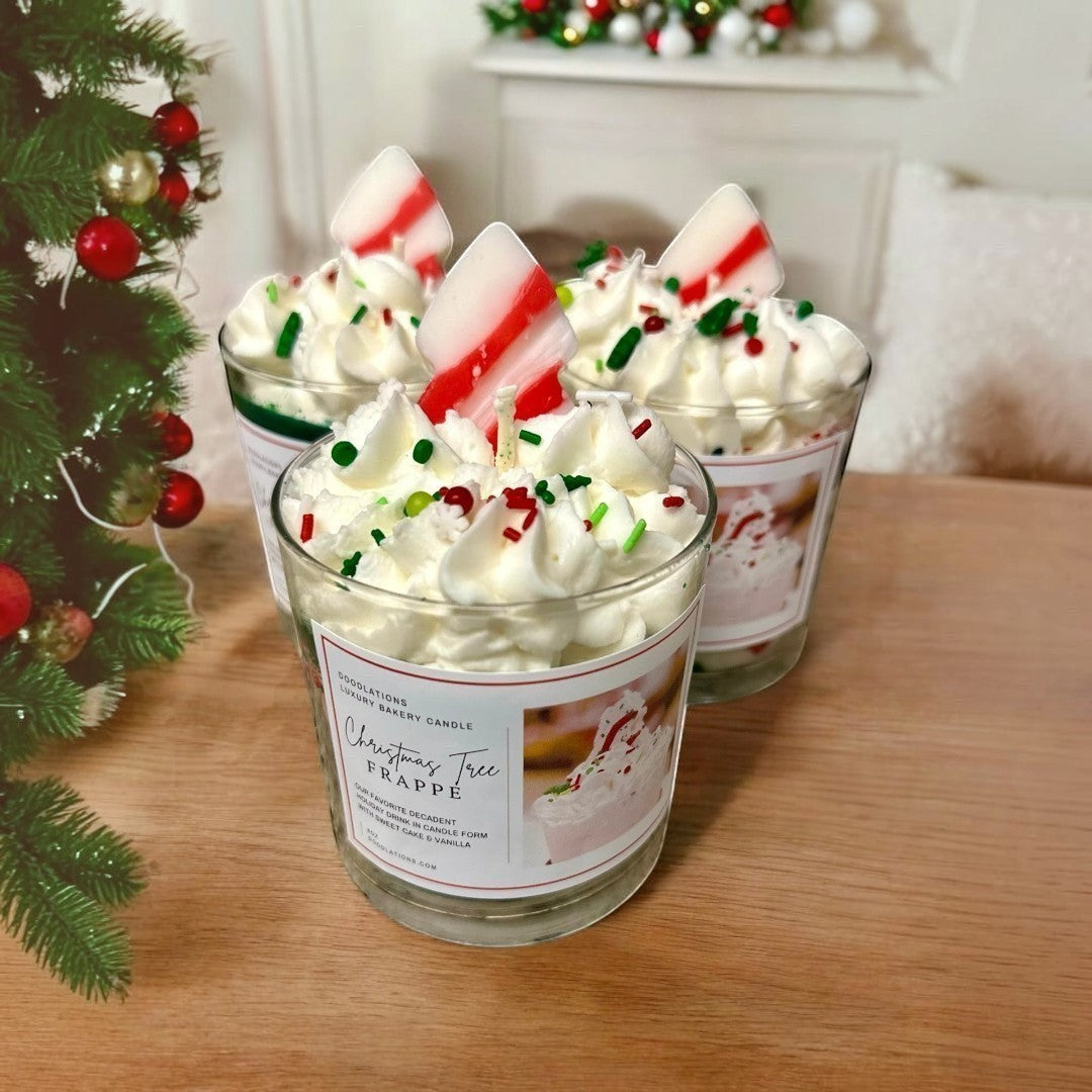 Doodlations Coffee Bar & Boutique Christmas Tree Frappe candle with whipped wax topping, sprinkles, and candy cane accent.