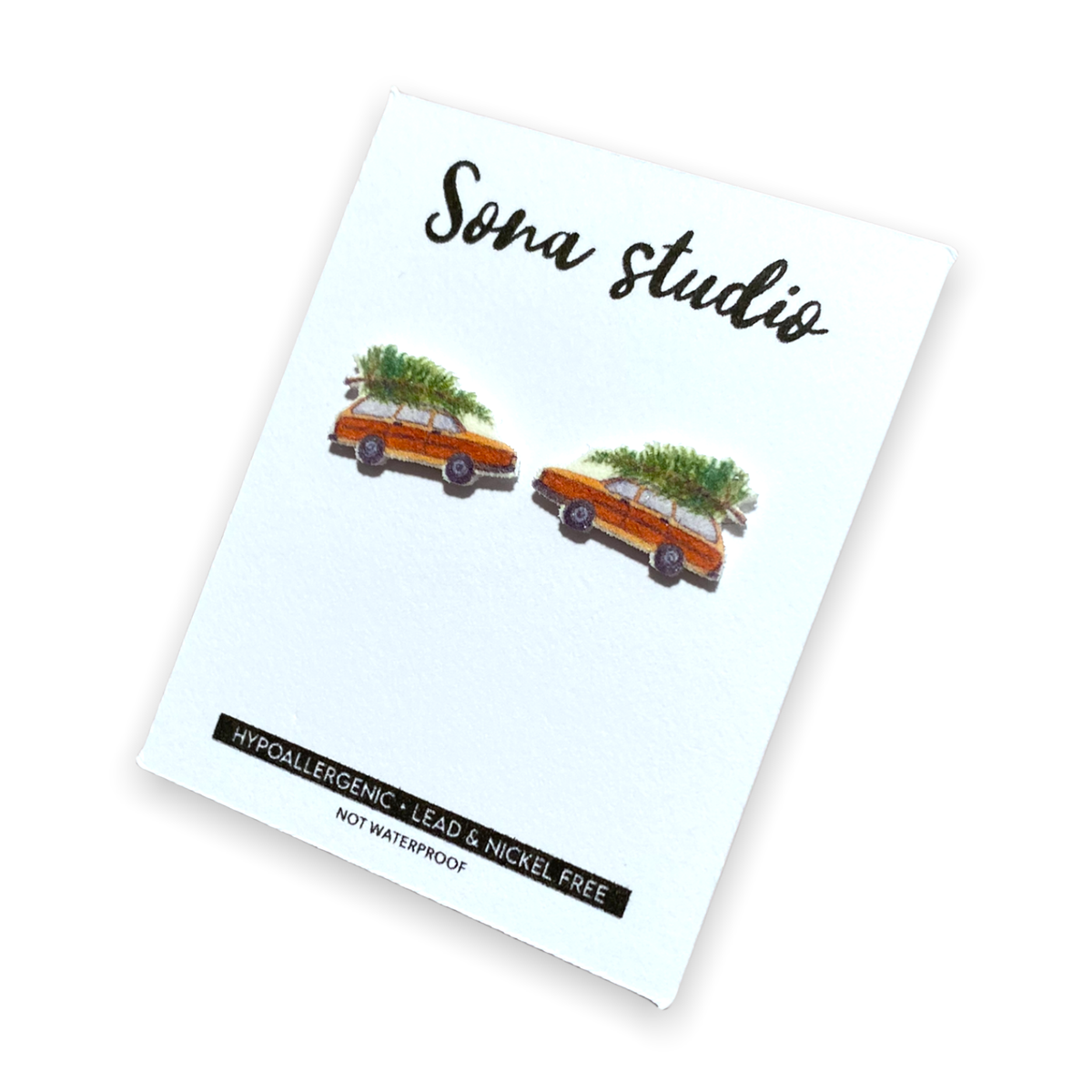 Doodlations Coffee Bar & Boutique Christmas wagon earrings featuring a vintage car with a tree on a display card