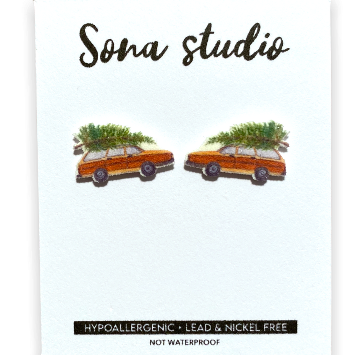 Doodlations Coffee Bar & Boutique Christmas wagon earrings featuring orange station wagons with pine trees on top