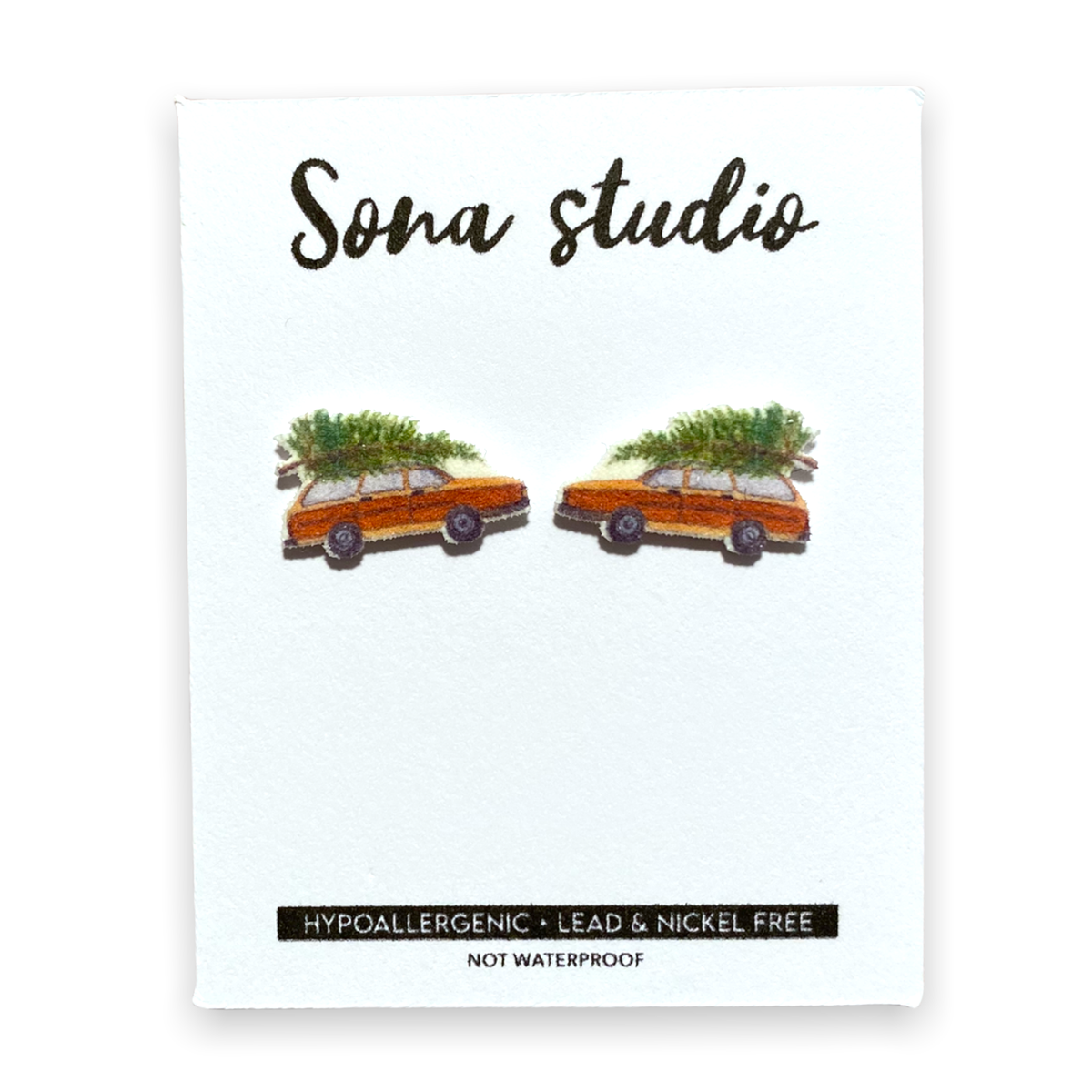 Doodlations Coffee Bar & Boutique Christmas wagon earrings featuring orange station wagons with pine trees on top.