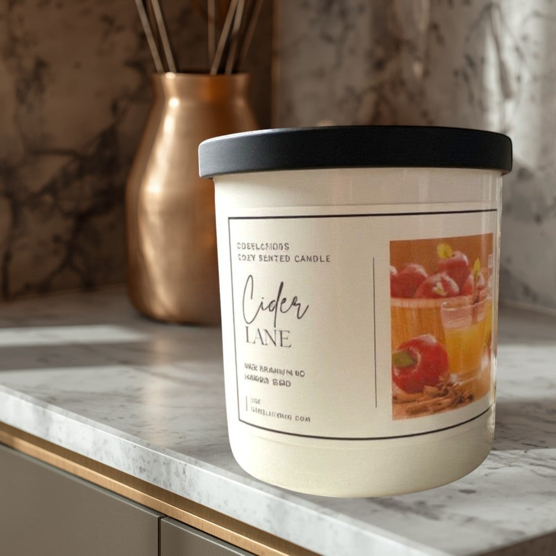 Doodlations Coffee Bar & Boutique Cider Lane cozy scented candle with warm apple cider, cinnamon, and vanilla notes.