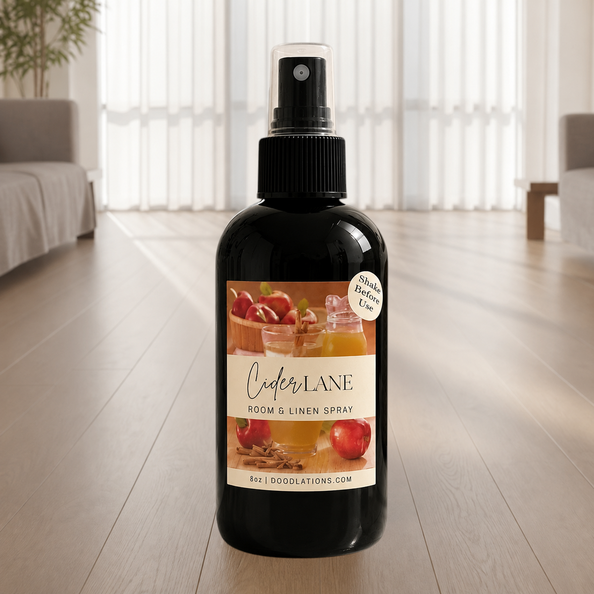 Doodlations Coffee Bar & Boutique Cider Lane room and linen spray in a black 8oz bottle with apple and spice label.