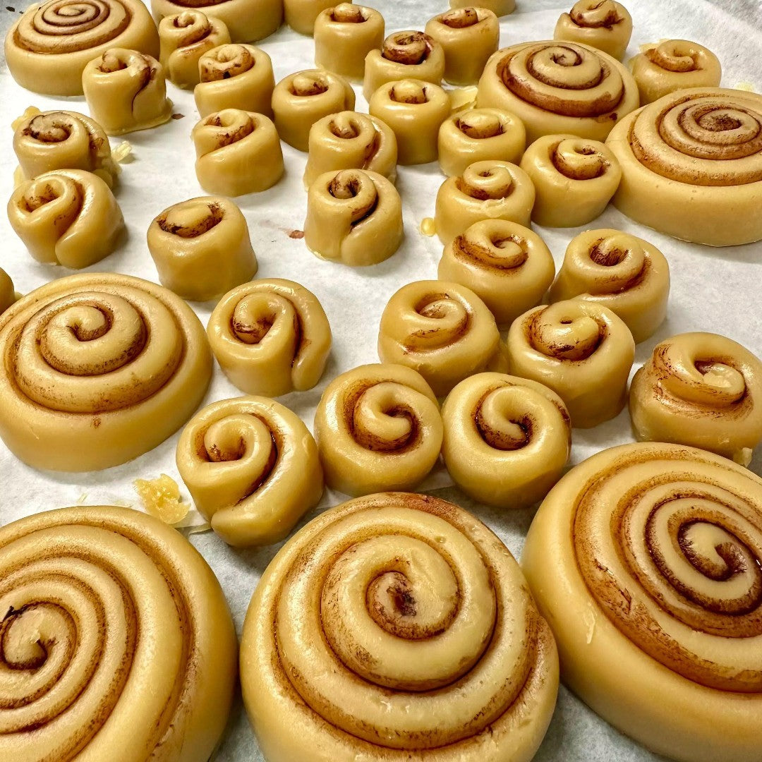 Doodlations Coffee Bar & Boutique Cinnamon Roll wax melts, shaped like mini cinnamon rolls with a swirl pattern.