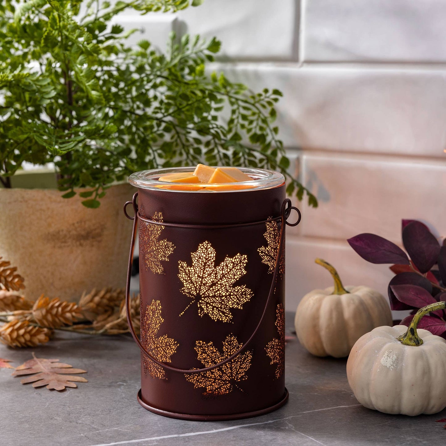 Doodlations Coffee Bar & Boutique antique copper wax warmer with cut-out fall leaf design and glass dish