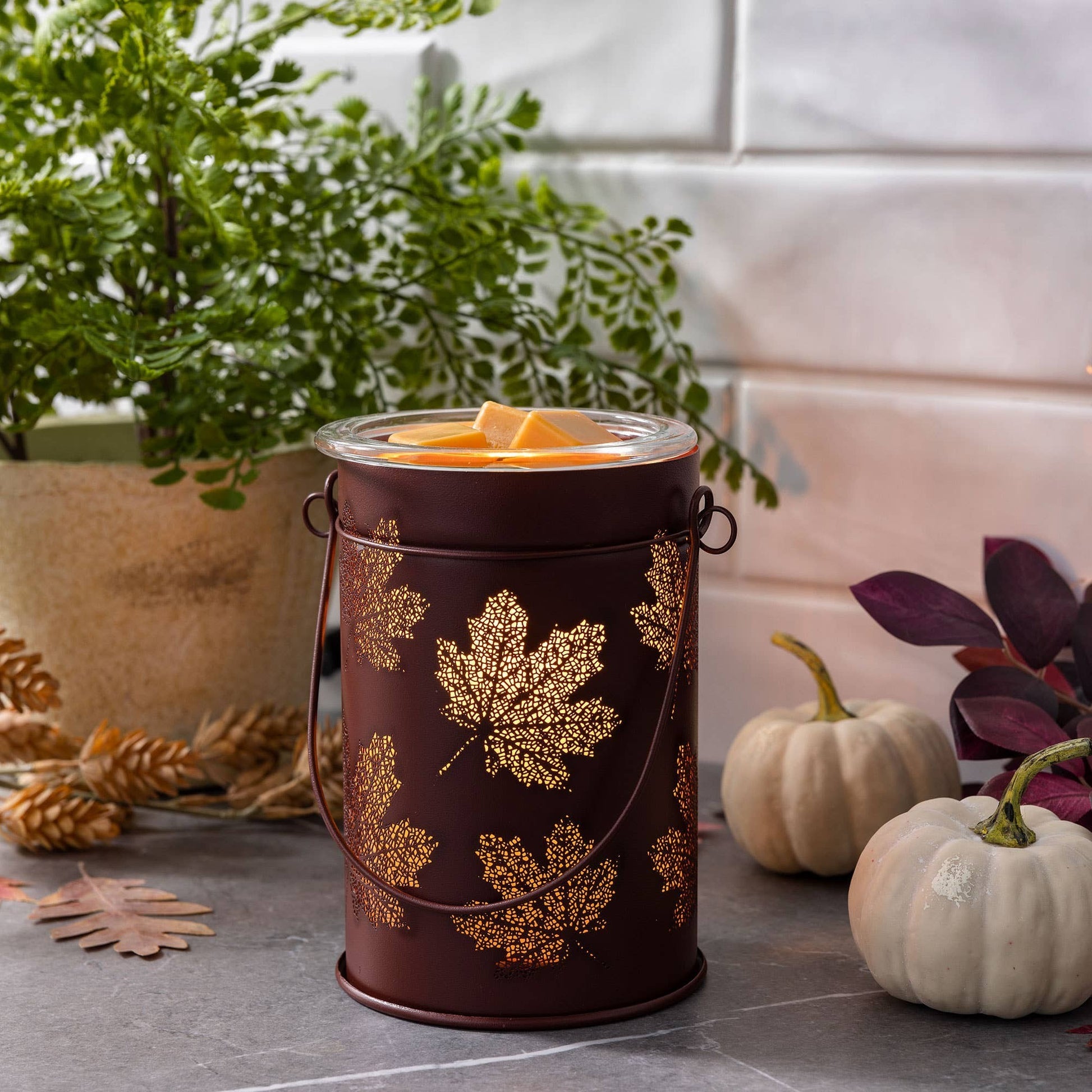 Doodlations Coffee Bar & Boutique antique copper wax warmer with cut-out fall leaf design and glass dish