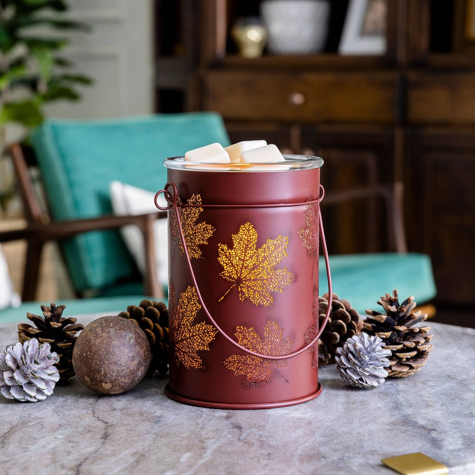 Doodlations Coffee Bar & Boutique antique-brushed copper wax warmer with cut-out fall leaf patterns and glass dish