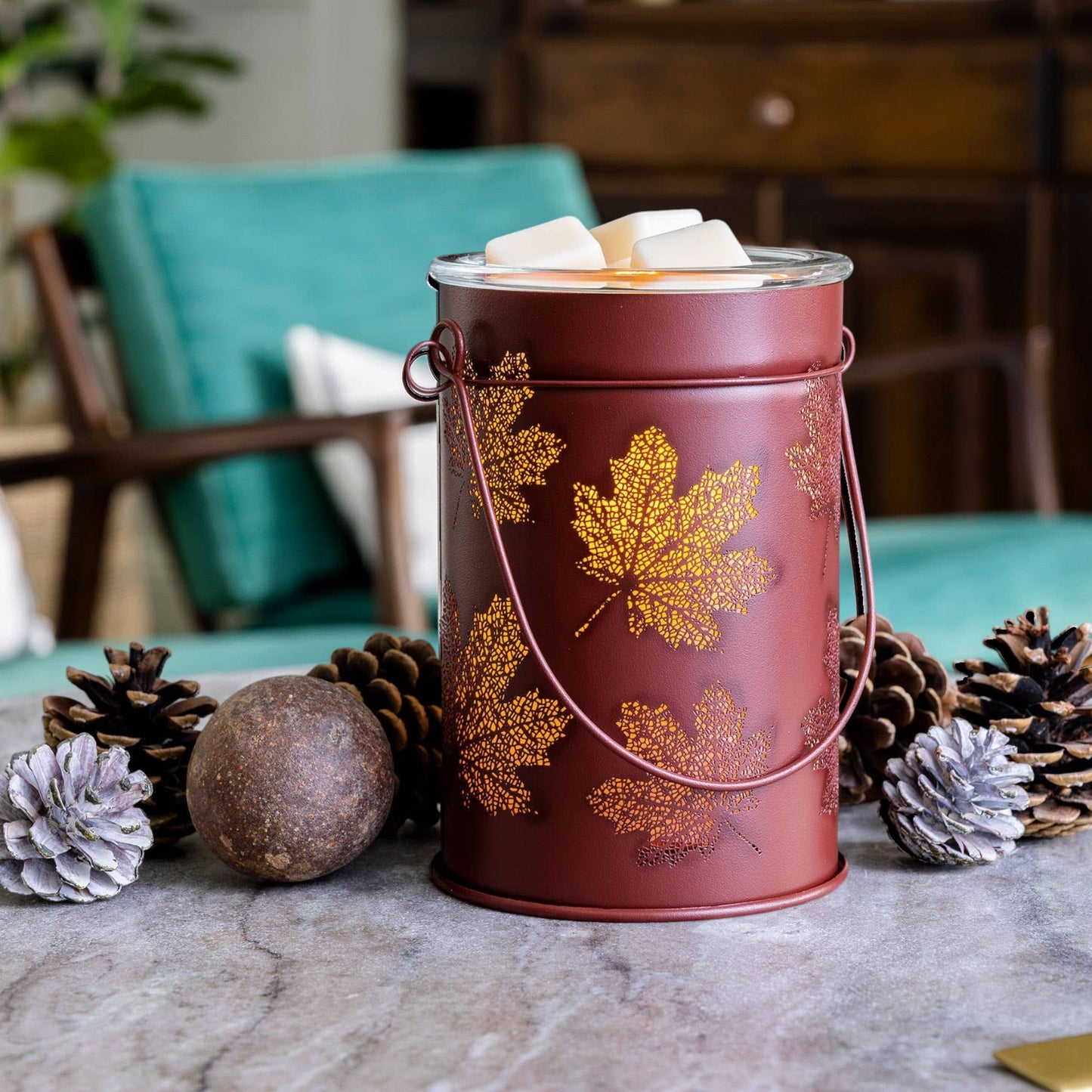 Doodlations Coffee Bar & Boutique antique-brushed copper wax warmer with cut-out fall leaf patterns and glass dish