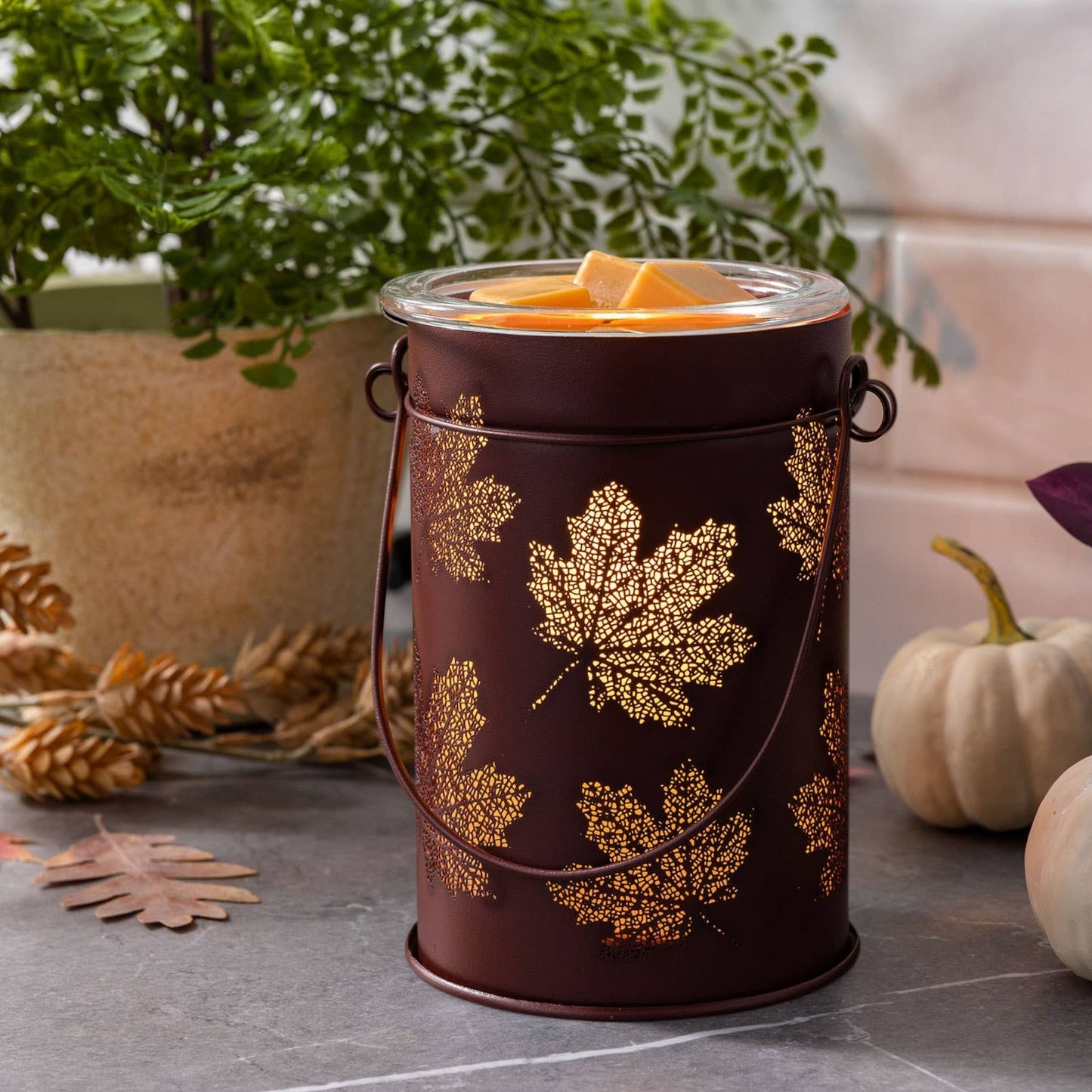 Doodlations Coffee Bar & Boutique antique copper wax warmer with cut-out fall leaf design and glass dish