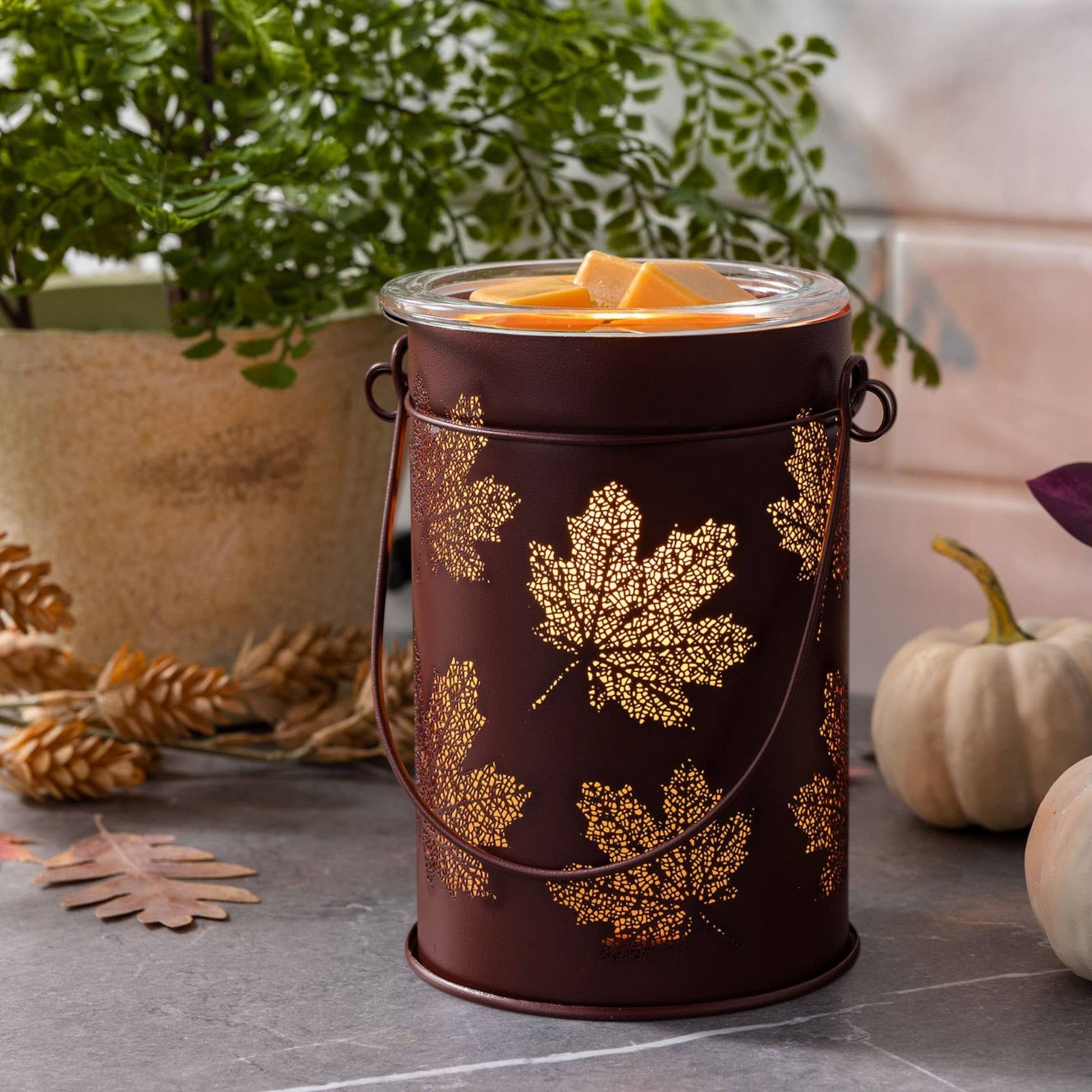 Doodlations Coffee Bar & Boutique antique copper wax warmer with cut-out fall leaf design and glass dish