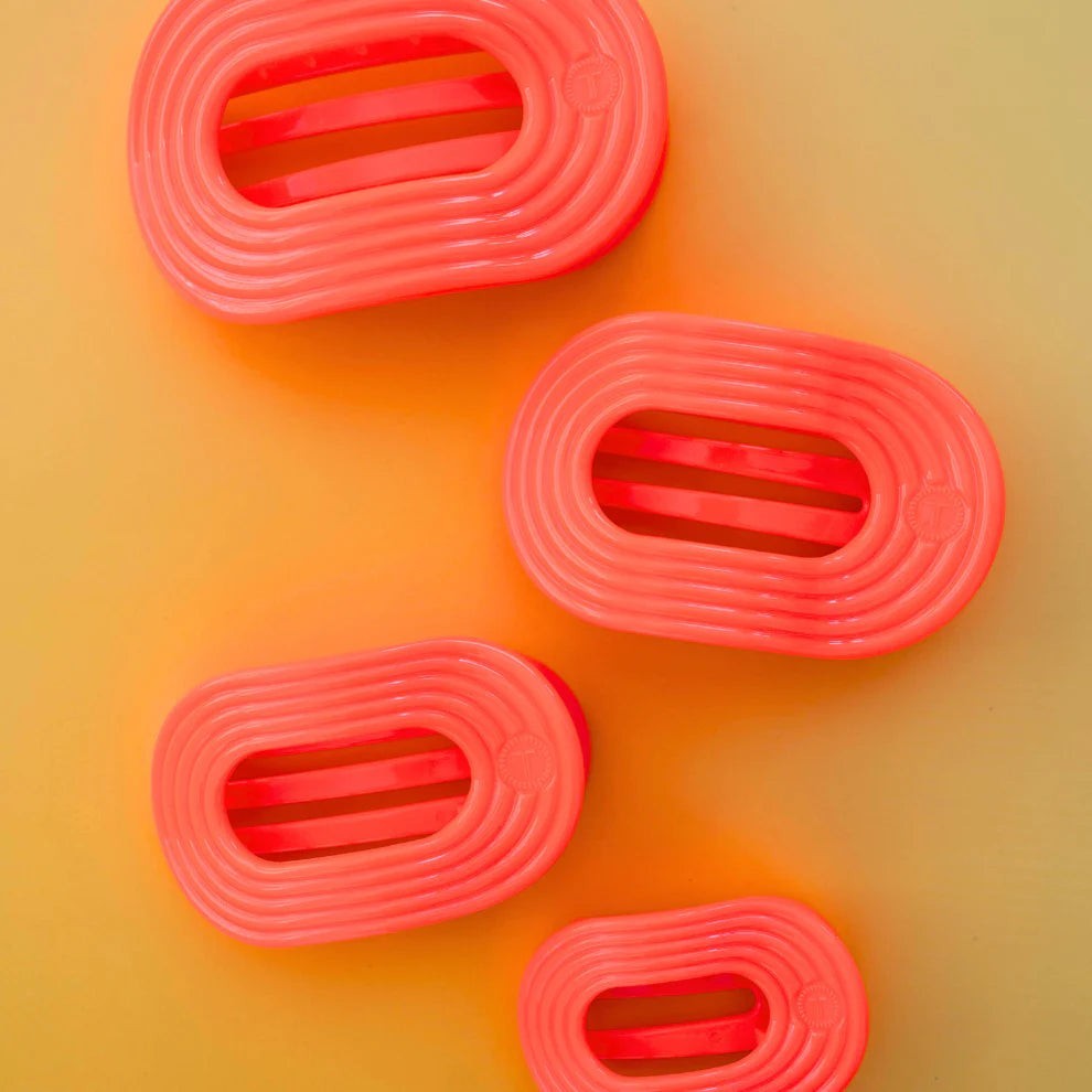 Doodlations Coffee Bar & Boutique coral flat round ribbed hair clips. Set of four.