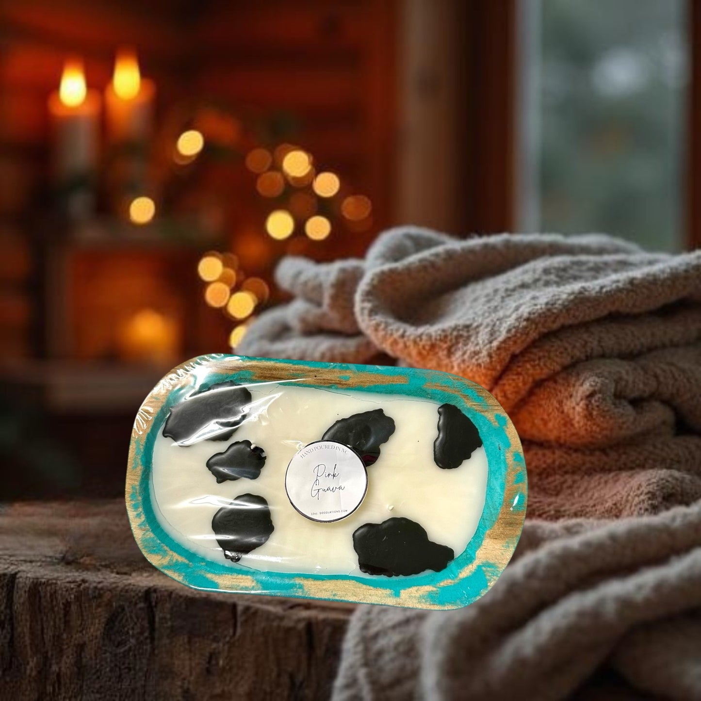 Doodlations Coffee Bar & Boutique Cow Dough Bowl Candle in Pink Guava scent, hand-poured wax with black cow spots.