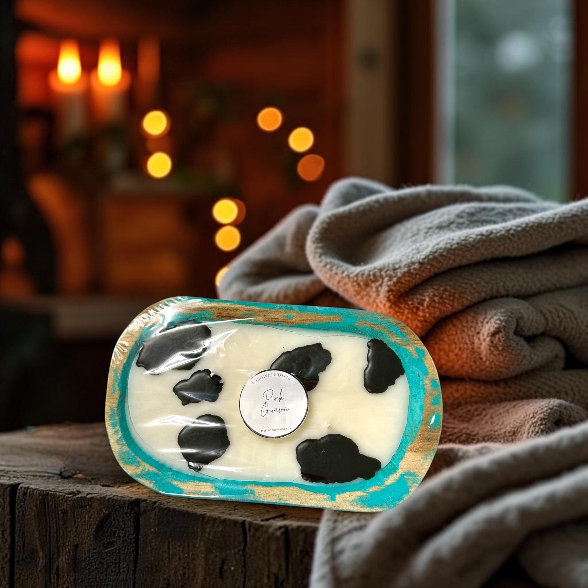 Doodlations Coffee Bar & Boutique Cow Dough Bowl Candle in Pink Guava scent, hand-poured wax with black cow spots.