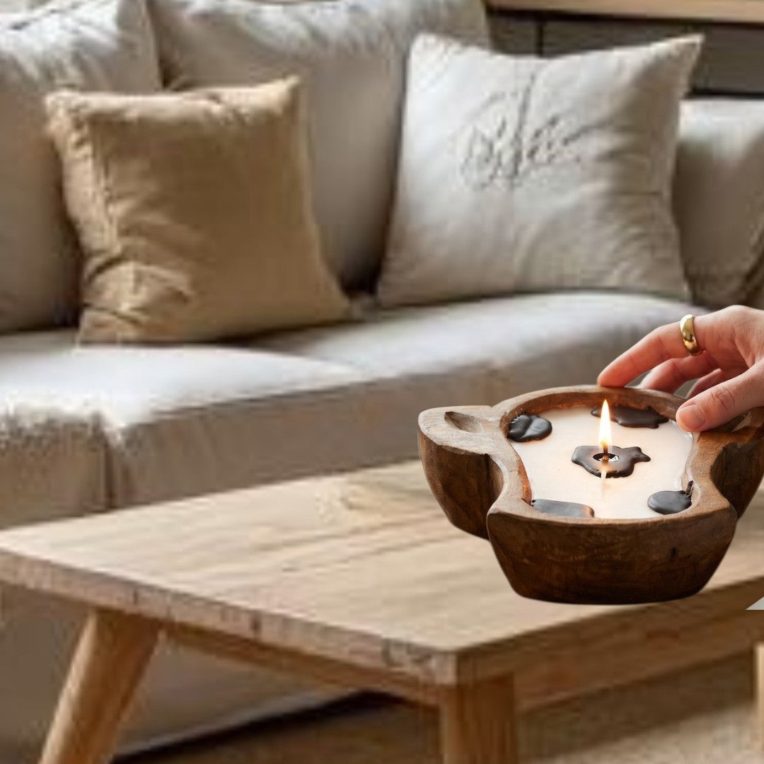 Doodlations Coffee Bar & Boutique mini cow head dough bowl candle with white wax and black cow spots.