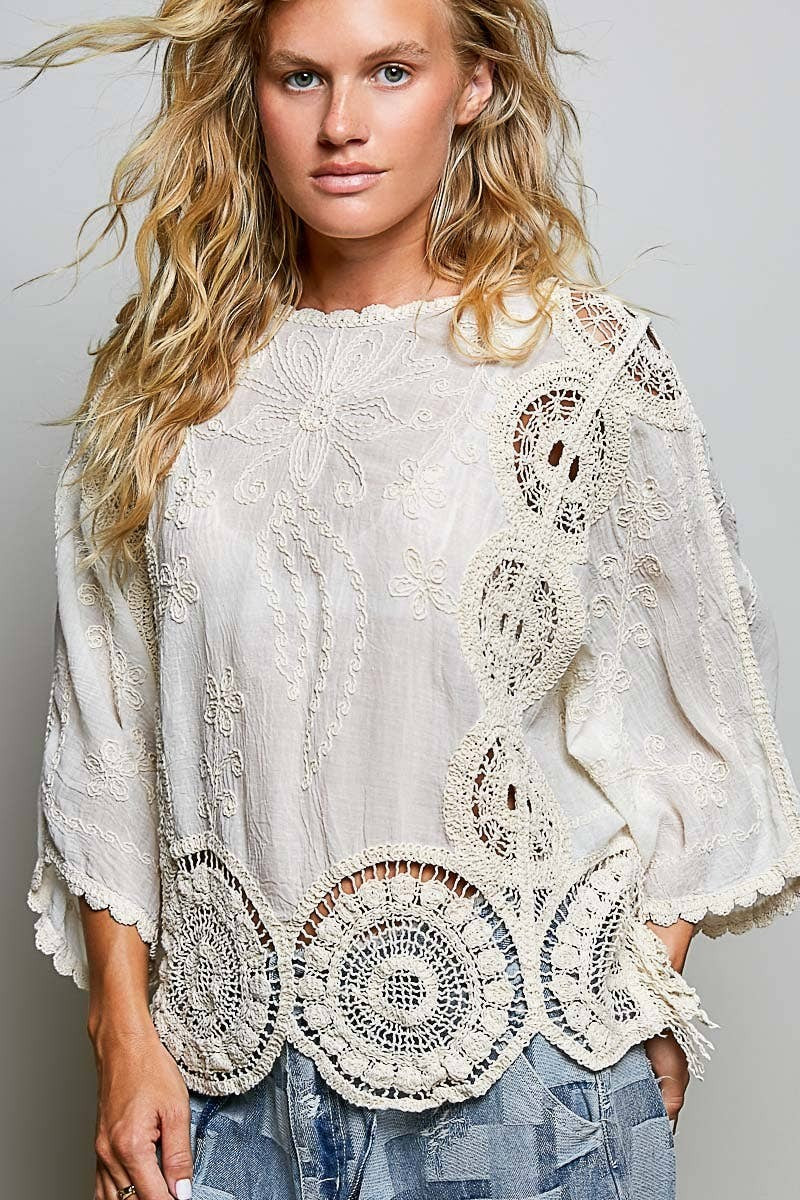 Doodlations Coffee Bar & Boutique cream crochet top with intricate floral embroidery and weave knit patterns