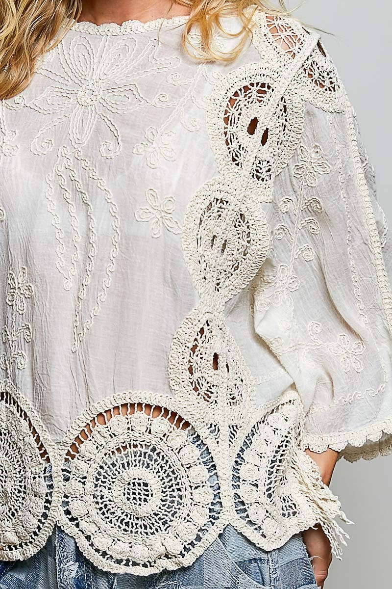 Doodlations Coffee Bar & Boutique cream crochet top with intricate floral embroidery and woven knit patterns