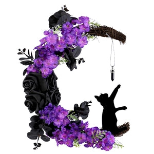 Doodlations Coffee Bar & Boutique crescent moon wreath with black roses, purple flowers, cat silhouette, and crystal.
