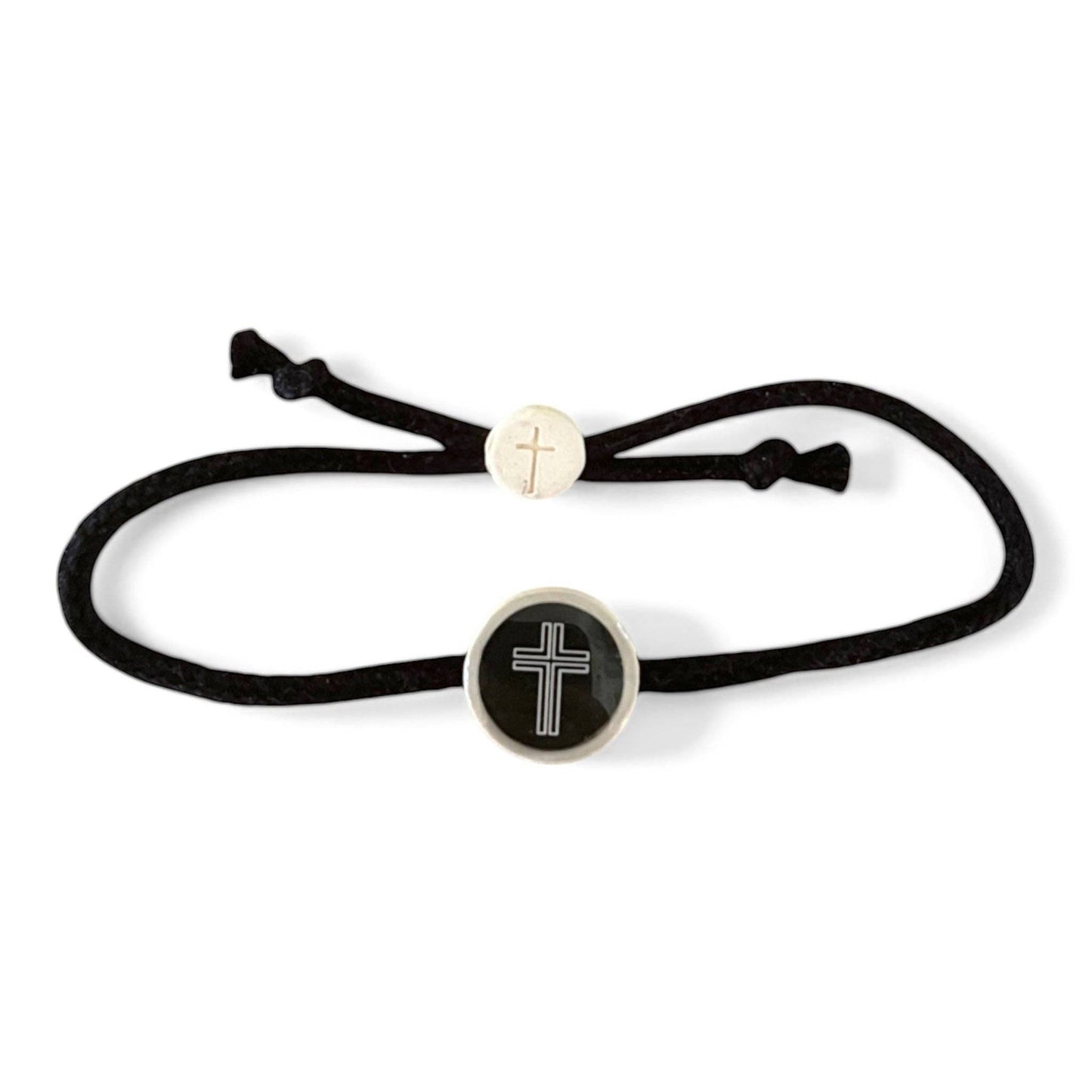 Doodlations Coffee Bar & Boutique black cord bracelet with a central cross charm and a smaller cross bead. NFC enabled.