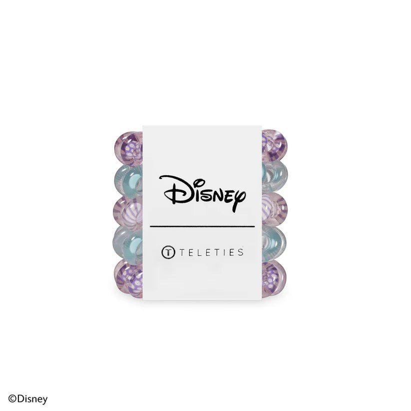 Doodlations Coffee Bar & Boutique Disney Daisy Duck tiny hair ties in purple and blue shades on a branded card.