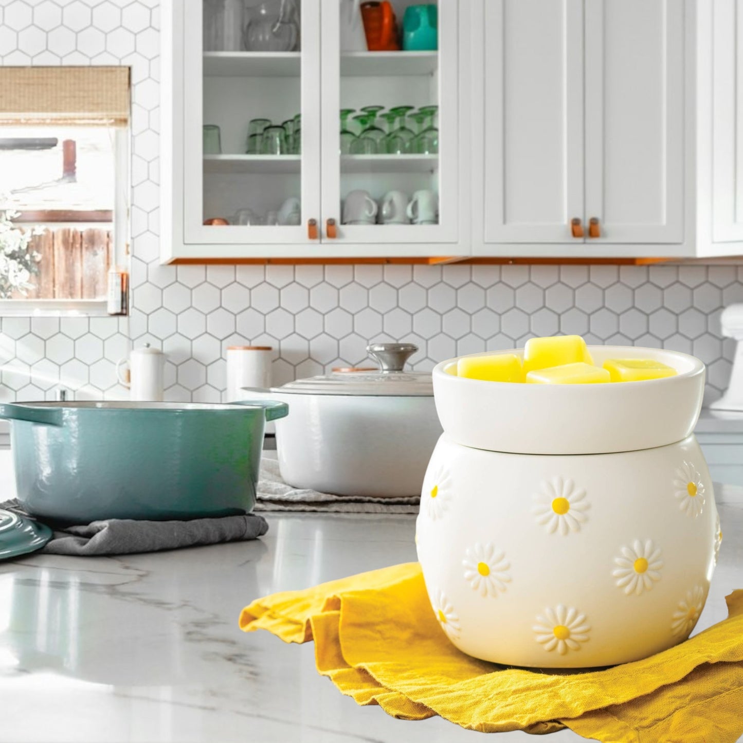 Doodlations Coffee Bar & Boutique white ceramic wax warmer with raised daisy design and yellow centers, filled with yellow wax melts.