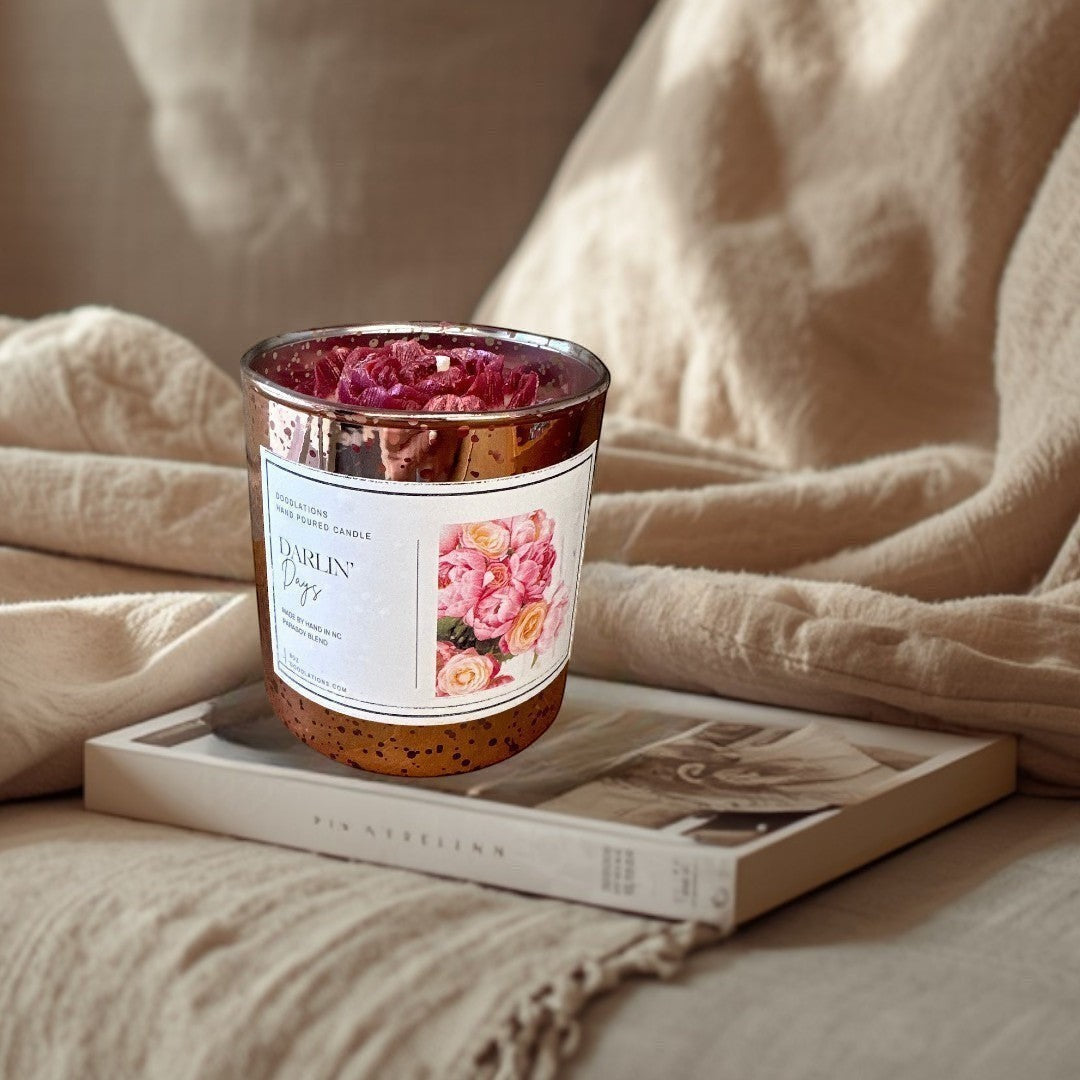 Darlin' Days floral candle in a rose gold mercury glass jar with pink and cream rose decorations.