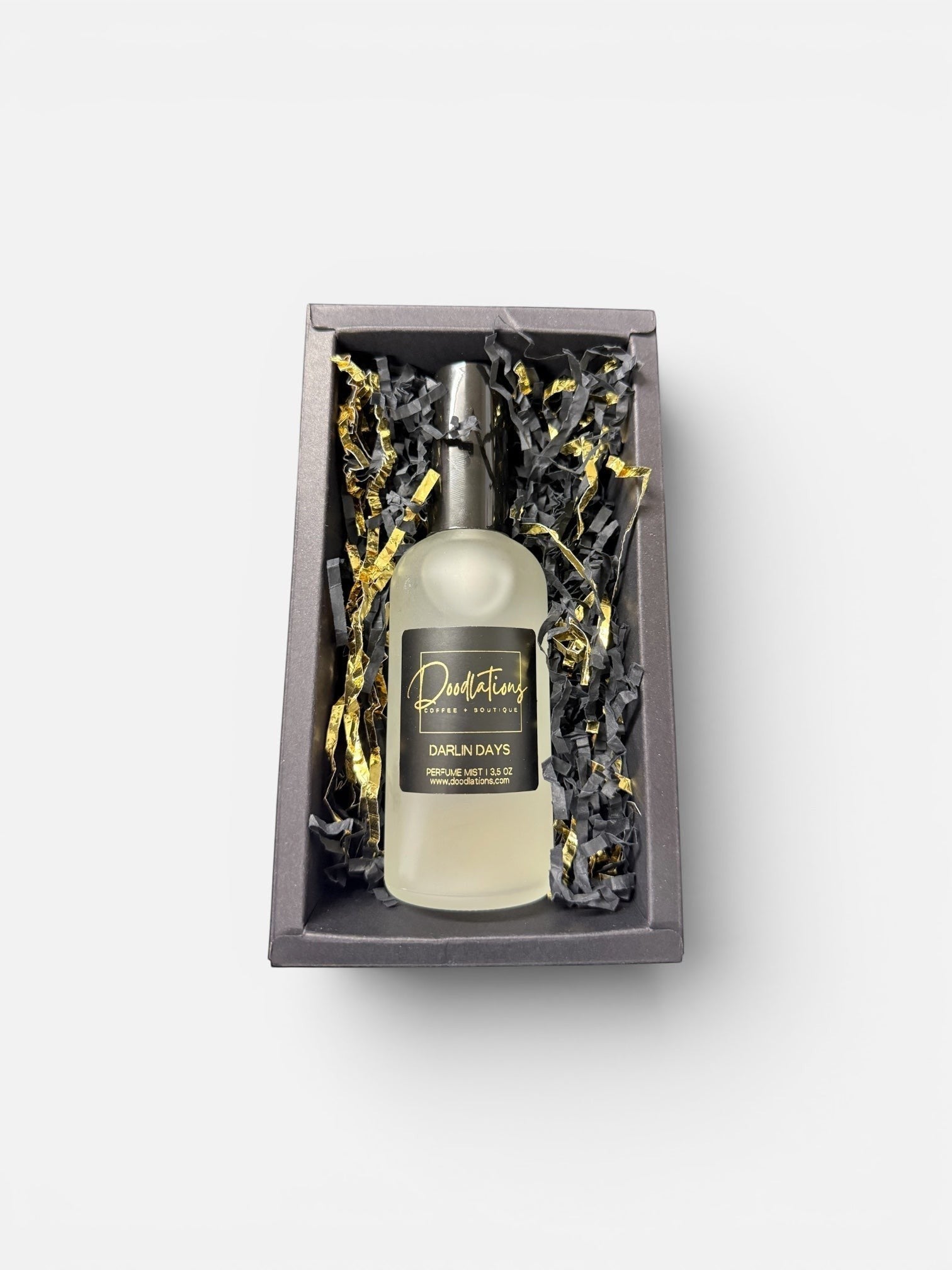 Doodlations Coffee Bar & Boutique Darlin Days luxury fine mist perfume in a glass bottle inside a gift box.