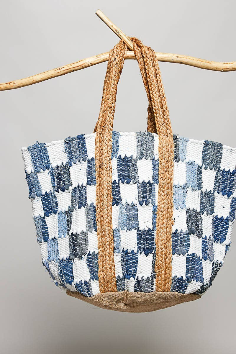 Doodlations Coffee Bar & Boutique handwoven denim checkerboard tote bag with braided straw handles and jute base.