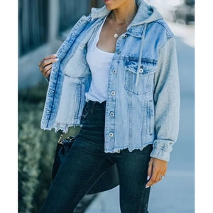 Doodlations Coffee Bar & Boutique oversized light-wash denim jacket with grey jersey sleeves and a hooded design.