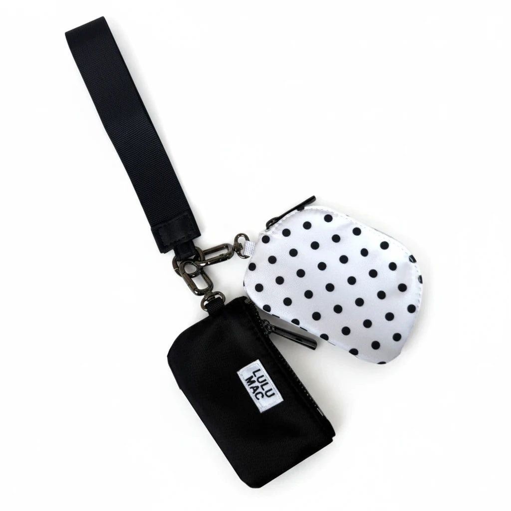 Doodlations Coffee Bar & Boutique Lulu Mac double pouch wristlet with one white polka dot and one solid black pouch.