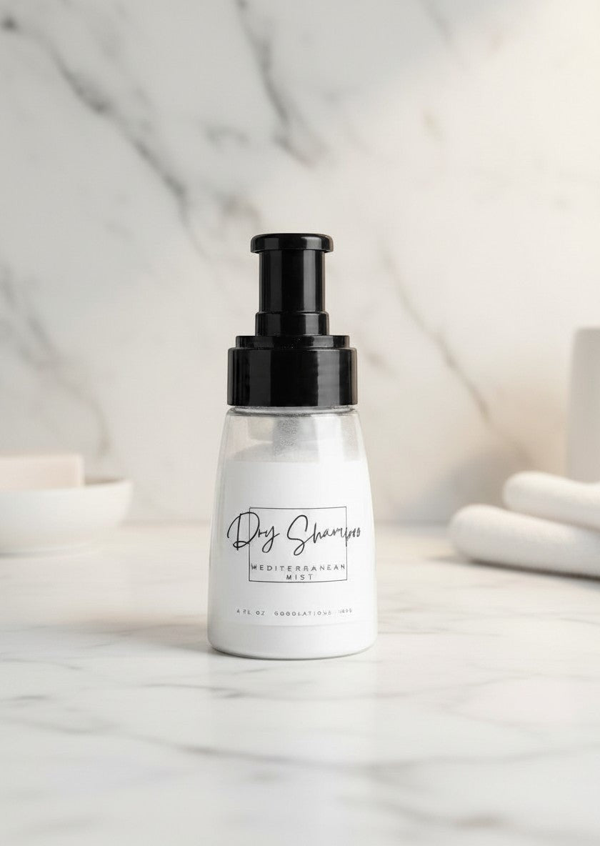 Doodlations Coffee Bar & Boutique dry powder shampoo in a clear bottle with black pump on a marble surface.