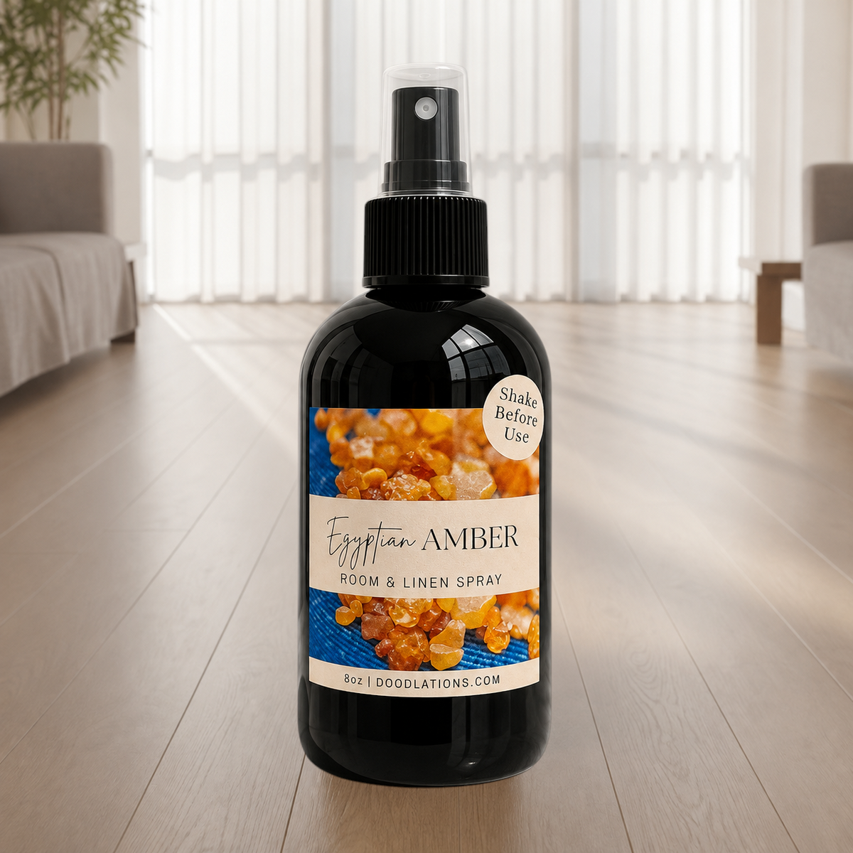Doodlations Coffee Bar & Boutique Egyptian Amber room and linen spray in a black bottle with a beige label