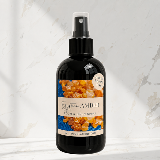 Doodlations Coffee Bar & Boutique Egyptian Amber room and linen spray in a black bottle with a decorative label