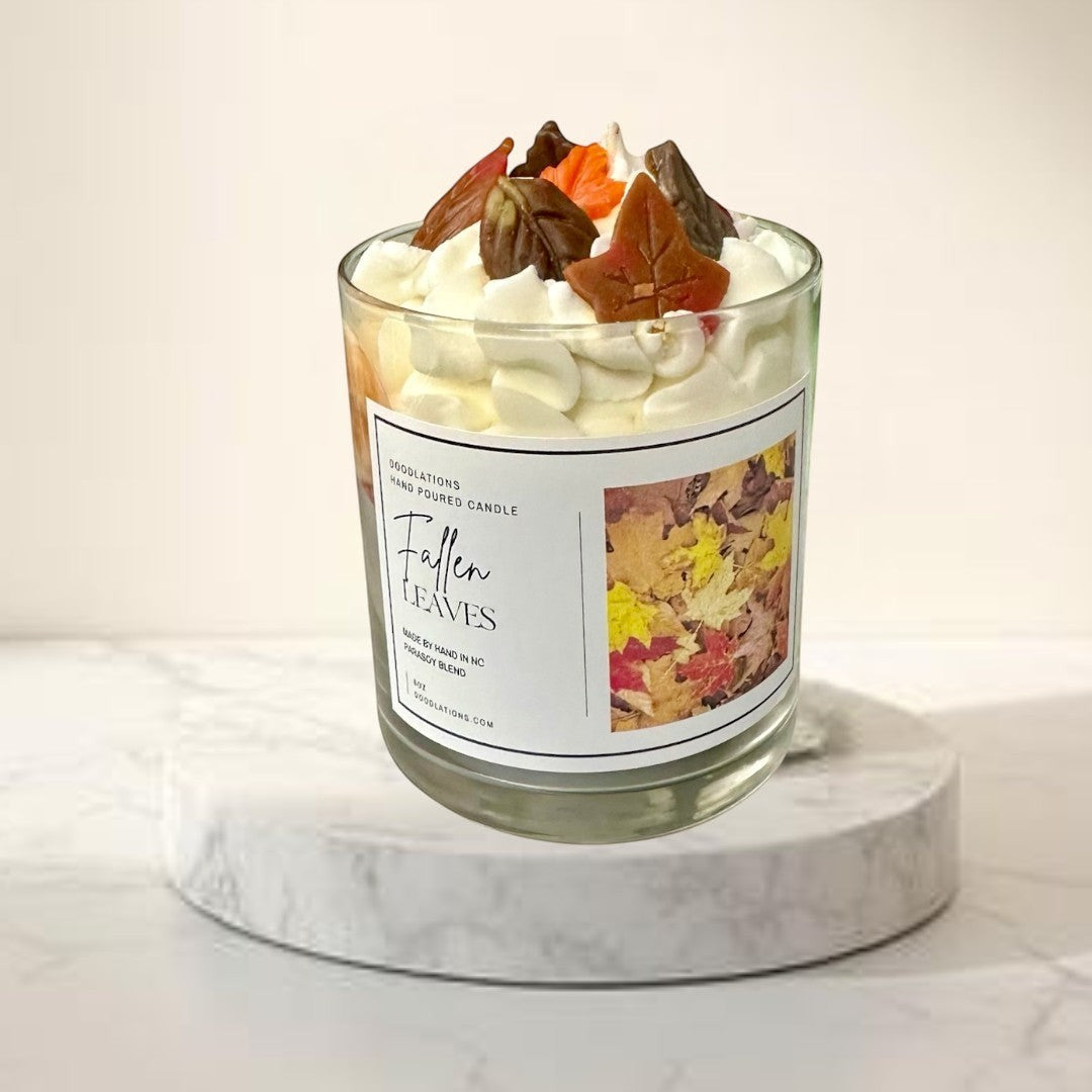 Doodlations Coffee Bar & Boutique Fallen Leaves hand-poured candle with realistic wax leaves and autumn scent.
