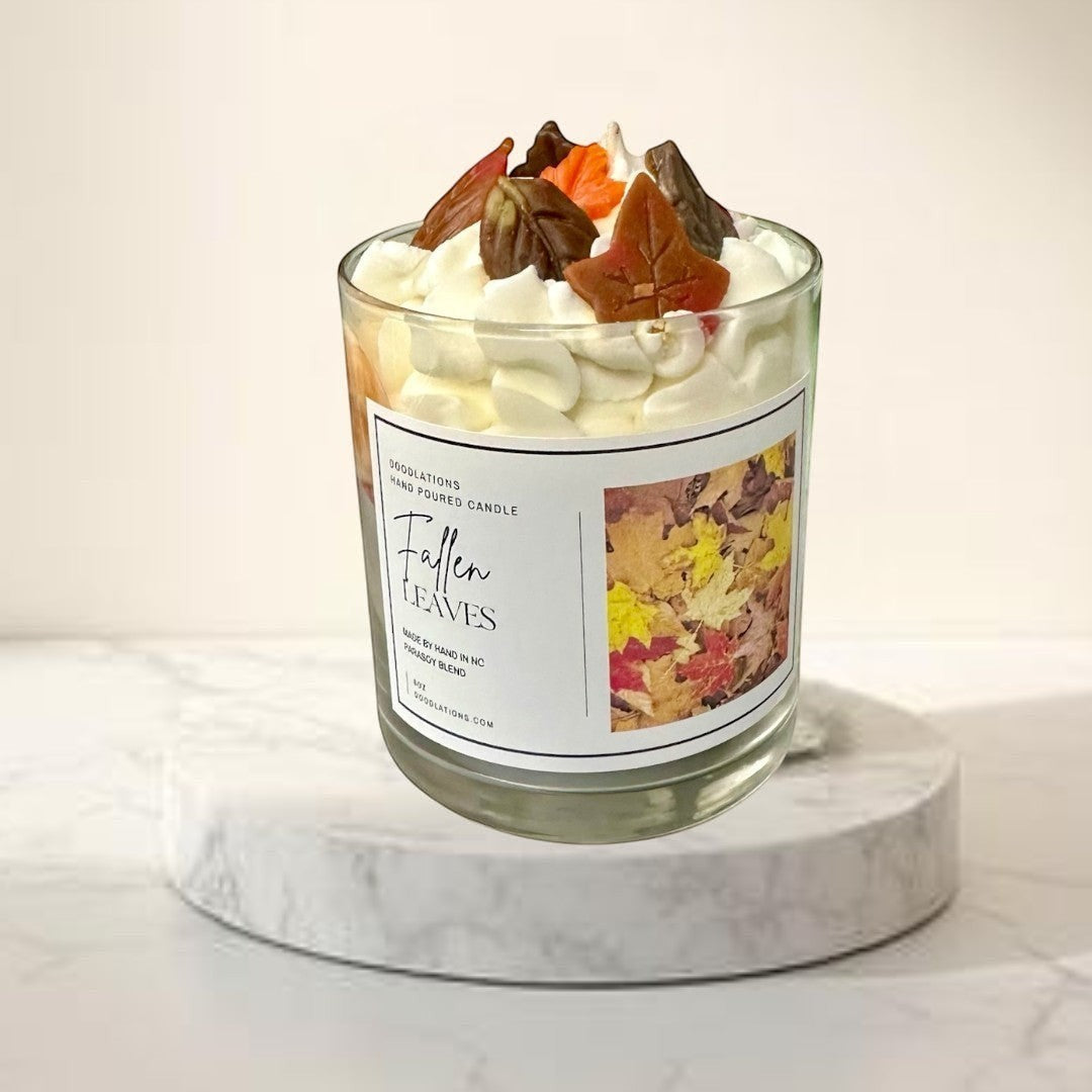Doodlations Coffee Bar & Boutique Fallen Leaves hand-poured candle with realistic wax leaves and autumn scent.