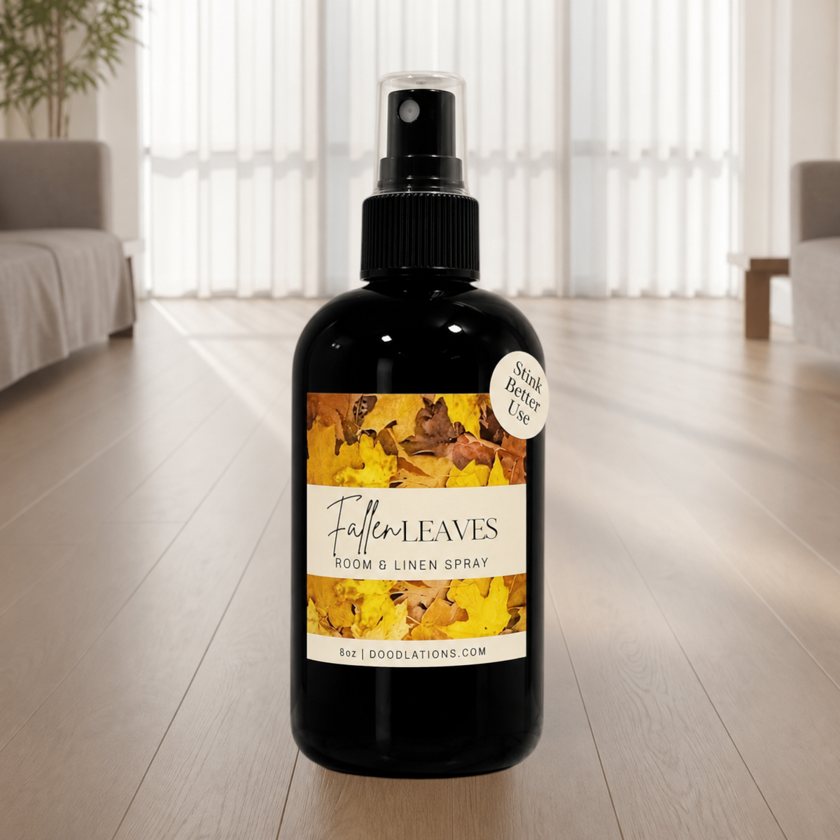 Doodlations Coffee Bar & Boutique Fallen Leaves room and linen spray in a black bottle with autumn leaf label design