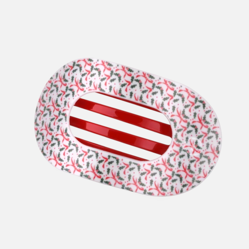 Doodlations Coffee Bar & Boutique Teleties flat round hair clip with a festive holly and red ribbon holiday pattern.