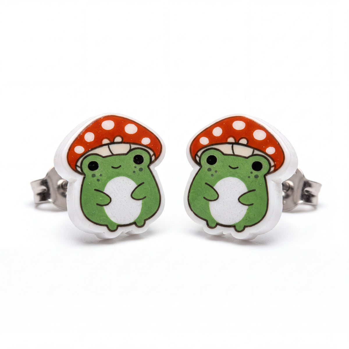 Doodlations Coffee Bar & Boutique handmade frog and mushroom stud earrings with titanium posts on white background.